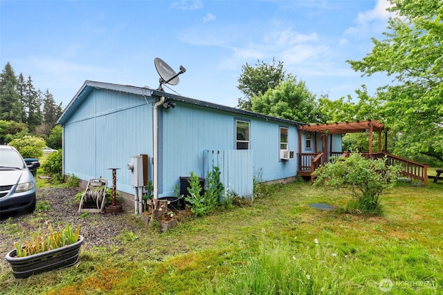 1201 8th St, Vader, WA 98593 - view of side of home featuring a pergola, a wooden deck, cooling unit, and a yard