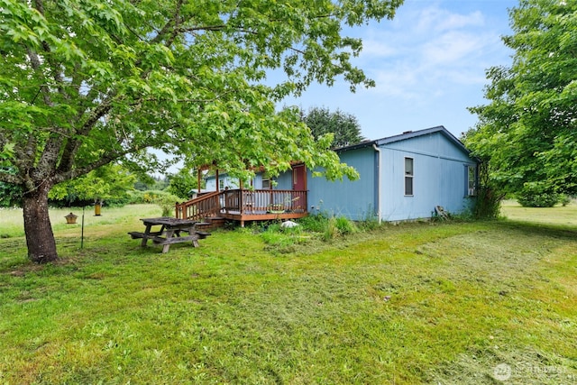 1201 8th St, Vader, WA 98593 - view of green lawn featuring a deck