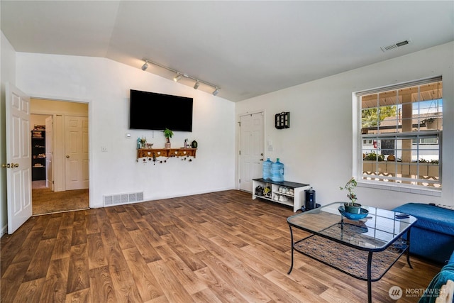 641 3rd Ave S, Kent, WA 98032 - living area with vaulted ceiling, wood finished floors, and rail lighting