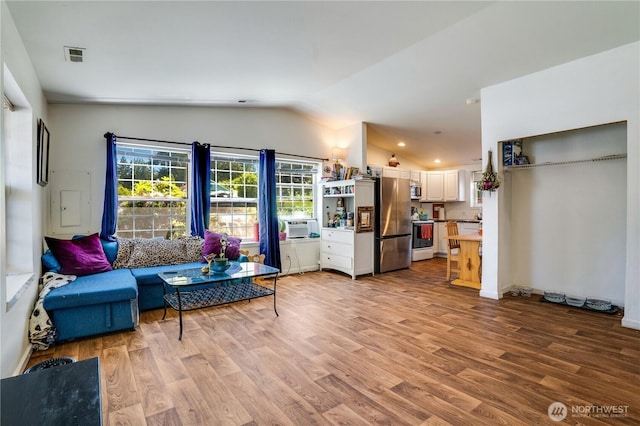 641 3rd Ave S, Kent, WA 98032 - living area with vaulted ceiling, wood finished floors, and cooling unit