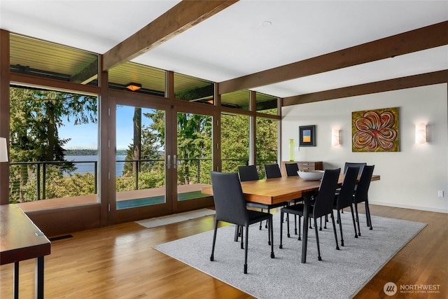 2019 Killarney Way, Bellevue, WA 98004 - dining room featuring beam ceiling, healthy amount of natural light, a water view, wood finished floors, and floor to ceiling windows