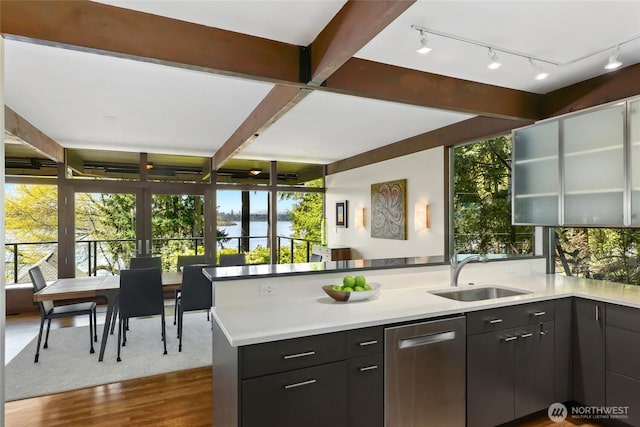 2019 Killarney Way, Bellevue, WA 98004 - kitchen with stainless steel dishwasher, a sink, a peninsula, a water view, and dark wood-style floors