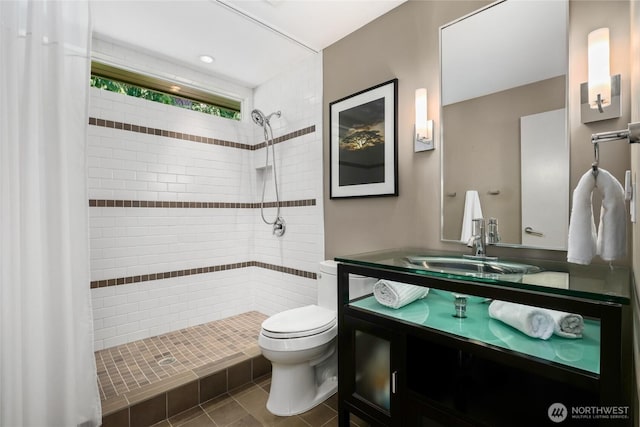 2019 Killarney Way, Bellevue, WA 98004 - full bathroom with toilet, tiled shower, vanity, and tile patterned flooring