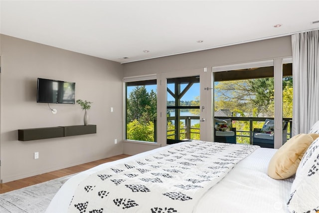 2019 Killarney Way, Bellevue, WA 98004 - bedroom featuring access to outside, wood finished floors, and baseboards