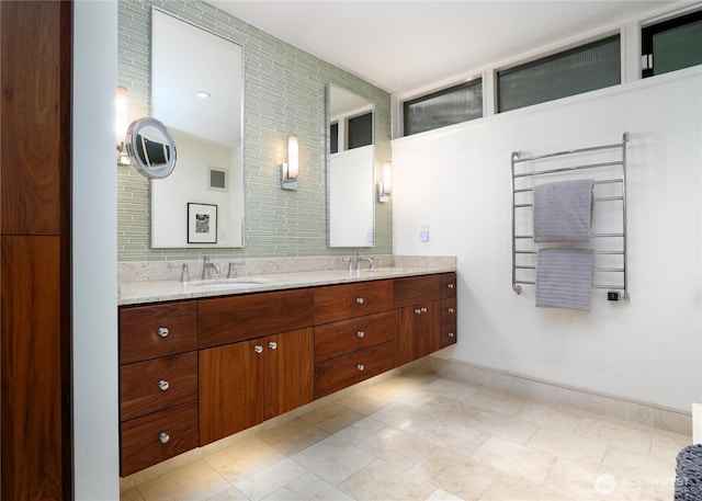 2019 Killarney Way, Bellevue, WA 98004 - full bathroom with double vanity, a towel warmer, tile patterned flooring, and baseboards