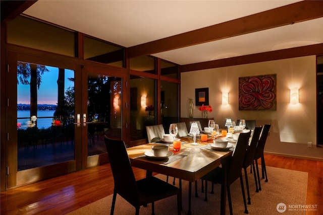 2019 Killarney Way, Bellevue, WA 98004 - dining area featuring a water view, wood finished floors, and beam ceiling