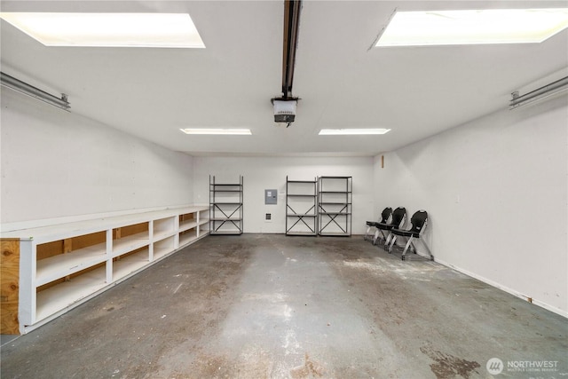 11101 Bingham Ave E, Tacoma, WA 98446 - garage featuring electric panel and a garage door opener