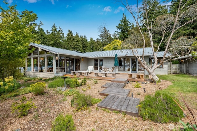 317 Eagles Roost Ln, Lopez Island, WA 98261 - rear view of property with a sunroom, metal roof, and a wooden deck