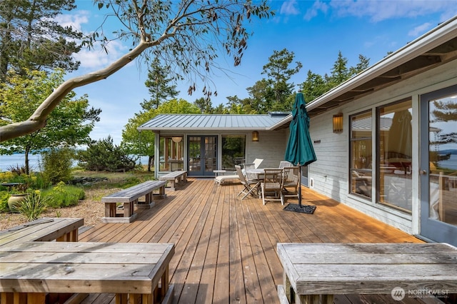 317 Eagles Roost Ln, Lopez Island, WA 98261 - wooden terrace with outdoor dining area and french doors