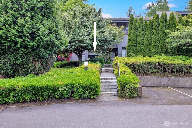 6581 137th Pl NE Unit 483, Redmond, WA 98052 - view of front facade featuring stairway and uncovered parking
