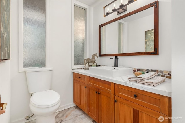 16822 SE 26th St, Bellevue, WA 98008 - bathroom featuring vanity, toilet, and baseboards