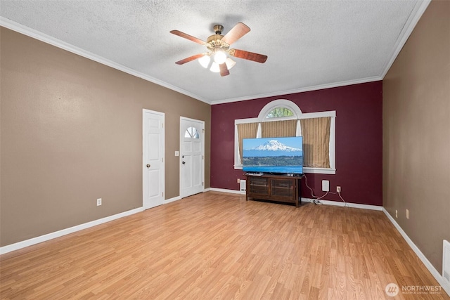 3710 Rucker Ave, Everett, WA 98201 - unfurnished living room with ceiling fan, a textured ceiling, wood finished floors, crown molding, and baseboards