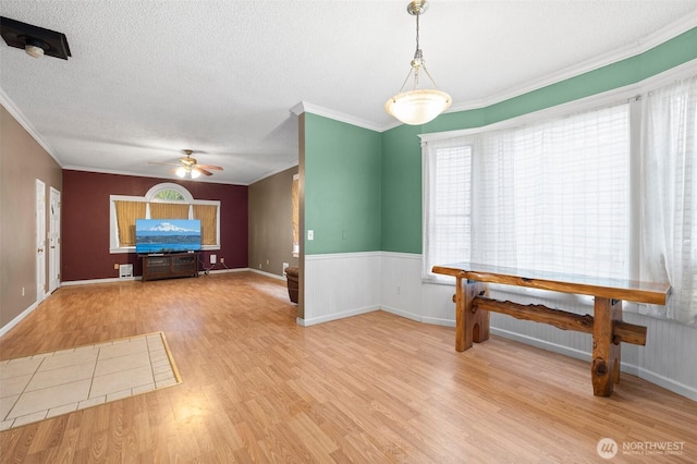 3710 Rucker Ave, Everett, WA 98201 - unfurnished dining area with ceiling fan, wood finished floors, crown molding, and a textured ceiling