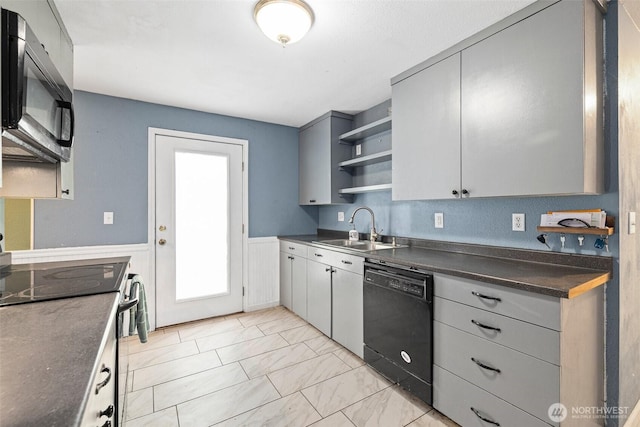 3710 Rucker Ave, Everett, WA 98201 - kitchen featuring black appliances, a sink, dark countertops, open shelves, and a wainscoted wall