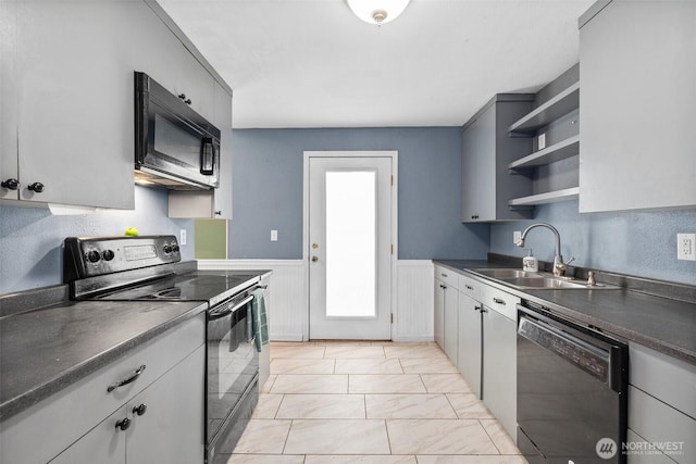 3710 Rucker Ave, Everett, WA 98201 - kitchen featuring black appliances, a sink, open shelves, dark countertops, and wainscoting