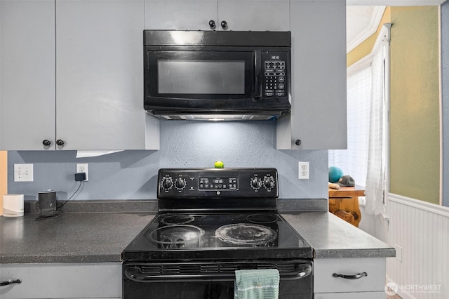 3710 Rucker Ave, Everett, WA 98201 - kitchen featuring black appliances, dark countertops, and white cabinets