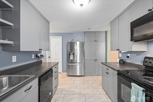 3710 Rucker Ave, Everett, WA 98201 - kitchen with black appliances, dark countertops, a sink, light marble finish floors, and gray cabinets