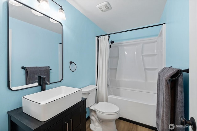 3710 Rucker Ave, Everett, WA 98201 - full bath with wood finished floors, toilet, vanity, and shower / bath combination with curtain