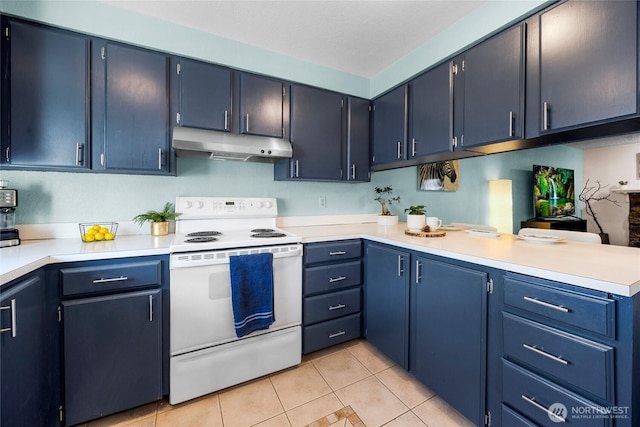 20110 60th Ave W Unit F26, Lynnwood, WA 98036 - kitchen with white electric range oven, under cabinet range hood, light tile patterned flooring, blue cabinetry, and light countertops
