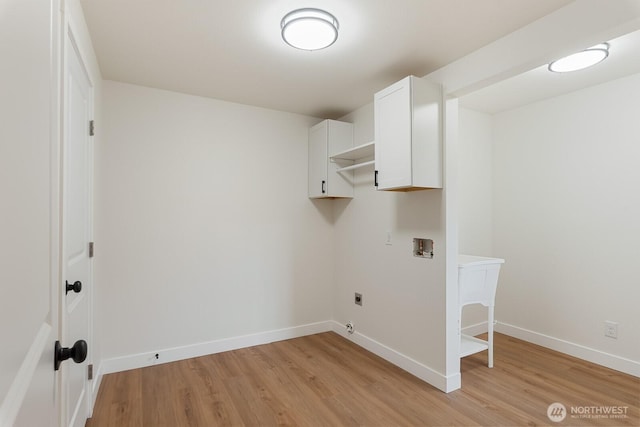 39966 Cape Horn Rd, Birdsview, WA 98237 - washroom featuring cabinet space, electric dryer hookup, washer hookup, light wood finished floors, and baseboards