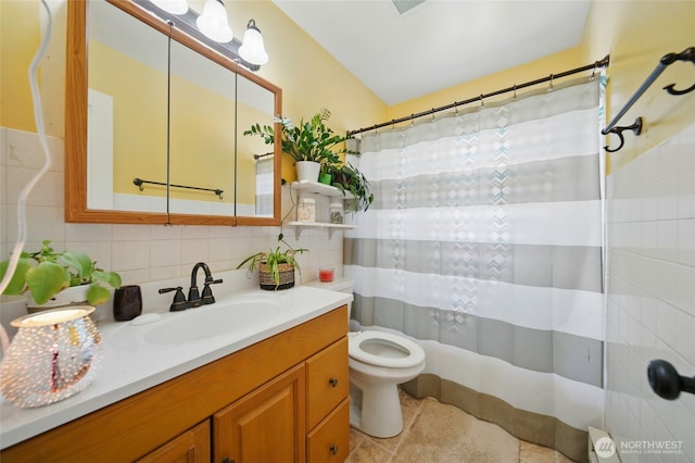 1832 Celestia Dr, Walla Walla, WA 99362 - full bath featuring vanity, toilet, backsplash, tile patterned flooring, and tile walls