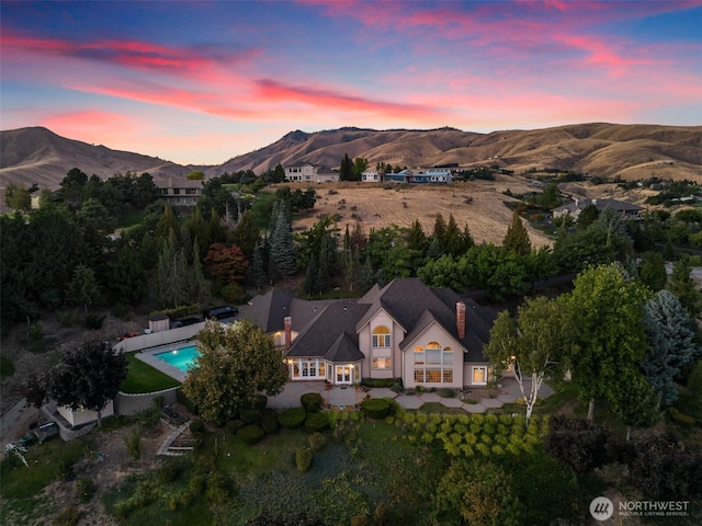 4180 April Dr, Wenatchee, WA 98801 - aerial view at dusk of a mountain view and view of pool