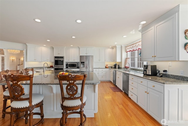 4180 April Dr, Wenatchee, WA 98801 - kitchen with appliances with stainless steel finishes, white cabinets, a sink, and recessed lighting
