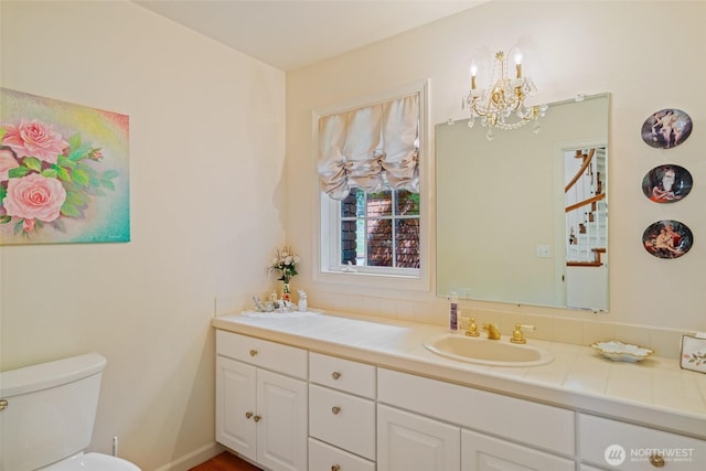 4180 April Dr, Wenatchee, WA 98801 - bathroom with a chandelier, double vanity, and toilet