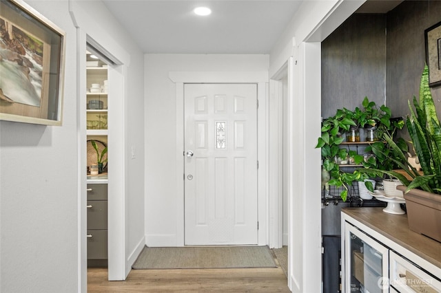 3161 Locust Ave, Bellingham, WA 98225 - foyer with wood finished floors, beverage cooler, baseboards, and recessed lighting