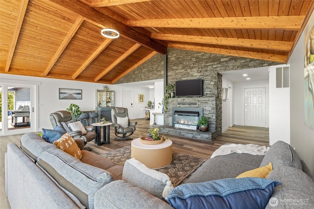 3161 Locust Ave, Bellingham, WA 98225 - living room featuring wood ceiling with exposed beams, wood finished floors, a stone fireplace, and high vaulted ceiling