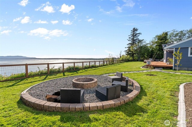 3161 Locust Ave, Bellingham, WA 98225 - view of yard featuring an outdoor fire pit and a deck with water view