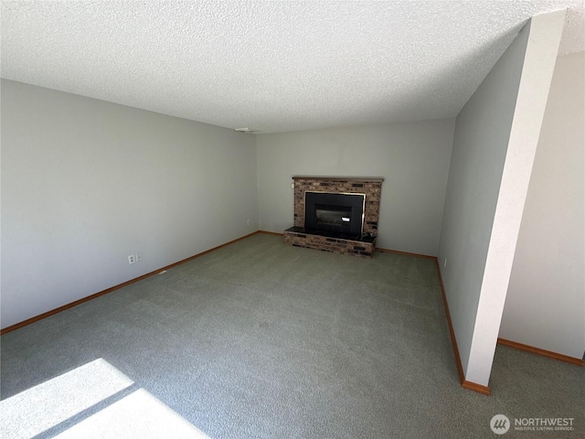 4882 Laura Ln SE, Port Orchard, WA 98367 - unfurnished living room with carpet floors, a brick fireplace, a textured ceiling, and baseboards