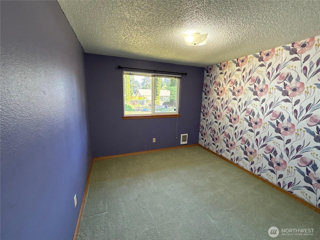 4882 Laura Ln SE, Port Orchard, WA 98367 - carpeted spare room featuring a textured ceiling and baseboards