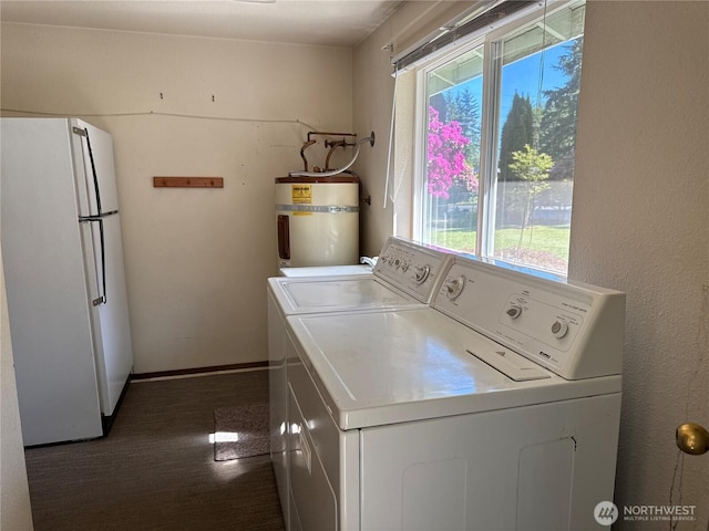 4882 Laura Ln SE, Port Orchard, WA 98367 - washroom with secured water heater, washing machine and dryer, and healthy amount of natural light