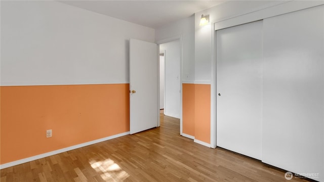 29604 22nd S, Federal Way, WA 98003 - unfurnished bedroom with wood finished floors, a closet, and baseboards