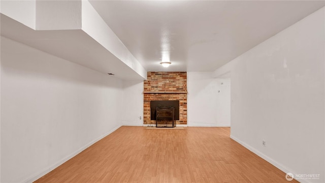 29604 22nd S, Federal Way, WA 98003 - unfurnished living room with wood finished floors, a fireplace, and baseboards