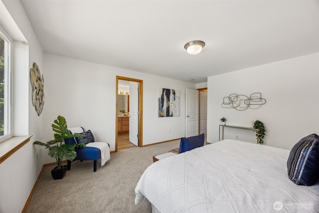 26151 242nd Ct SE, Maple Valley, WA 98038 - bedroom with carpet flooring, baseboards, and ensuite bath