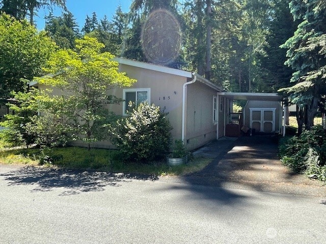 11410 127th St E Unit 185, Puyallup, WA 98374 - view of property exterior with crawl space