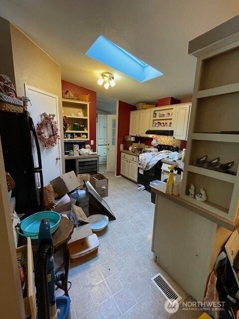 11410 127th St E Unit 185, Puyallup, WA 98374 - kitchen with a skylight and open shelves