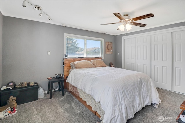 108 2nd St SE, Rainier, WA 98576 - bedroom with carpet floors, a closet, ceiling fan, and baseboards