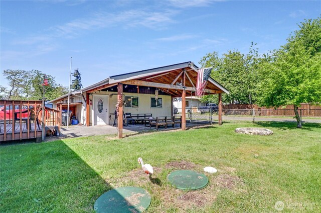108 2nd St SE, Rainier, WA 98576 - view of yard with a patio area and a deck