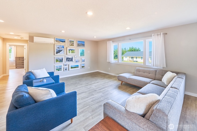 31810 I St, Ocean Park, WA 98640 - living area featuring a wall mounted AC, plenty of natural light, light wood finished floors, and recessed lighting