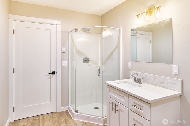 31810 I St, Ocean Park, WA 98640 - full bathroom featuring a stall shower, vanity, and wood finished floors
