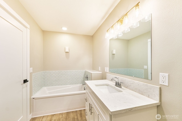 31810 I St, Ocean Park, WA 98640 - full bathroom with wood finished floors, a bath, and vanity