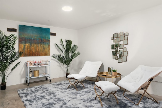 633 13th Ave E, Seattle, WA 98102 - sitting room with concrete flooring