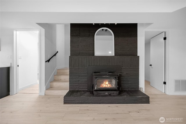 406 Center Pl, Everett, WA 98203 - detailed view of wood finished floors, a brick fireplace, and baseboards