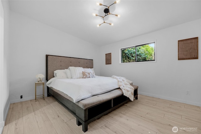 406 Center Pl, Everett, WA 98203 - bedroom with a chandelier, wood finished floors, and baseboards
