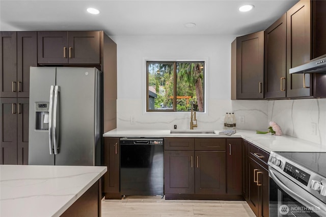 406 Center Pl, Everett, WA 98203 - kitchen featuring appliances with stainless steel finishes, a sink, light stone countertops, recessed lighting, and dark brown cabinets