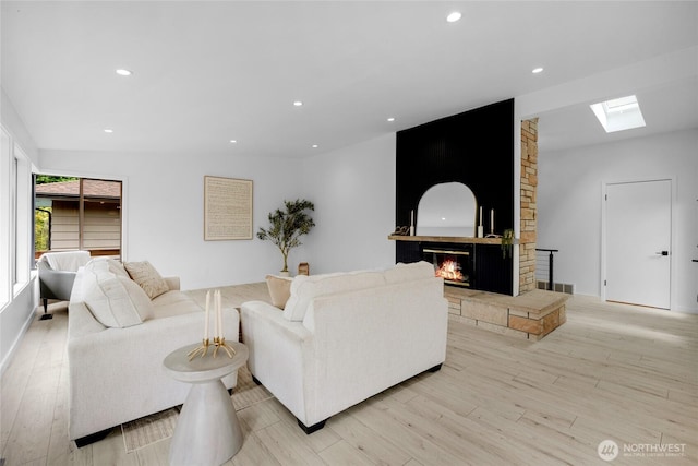 406 Center Pl, Everett, WA 98203 - living area with a skylight, light wood-style floors, a fireplace, and recessed lighting