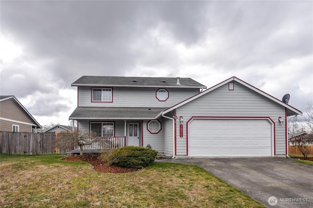 16229 Prairie Creek Loop SE, Yelm, WA 98597 - traditional home with a porch, driveway, and an attached garage